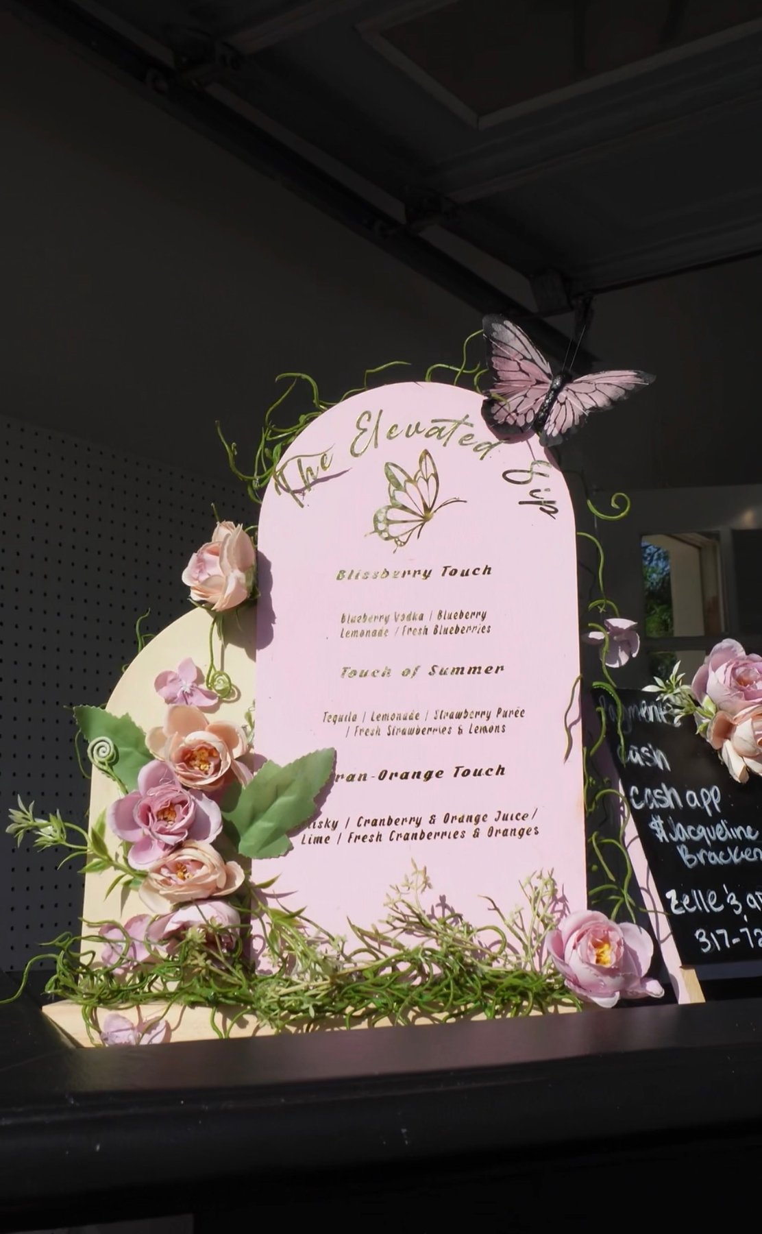 Butterfly and floral drink menu sign